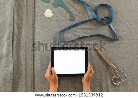 Foto stock: Tailor Using Her Tablet Pc In Work