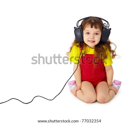 Little Serious Girl Listens To Music In Big Headphones Stockfoto © pzAxe