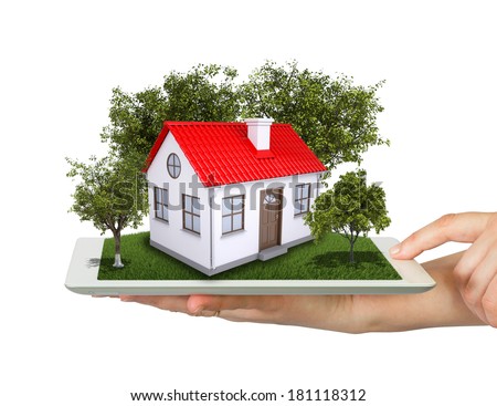 Hands Holding Tablet Pc And Small House With Land [[stock_photo]] © cherezoff