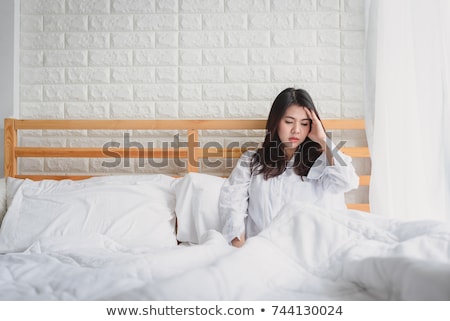 Stok fotoğraf: Depressed Woman Waking Up In Her Bedroom