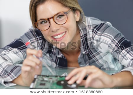 ストックフォト: Woman Fixing A Motherboard