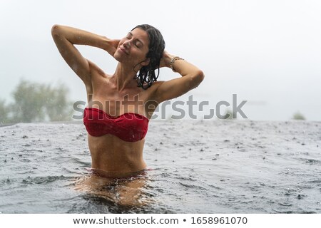 Stok fotoğraf: Woman In Swimwear With Hand Behind Her Head