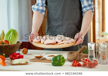 Zdjęcia stock: Man Cooking Chicken On Barbecue Grill