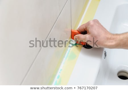 Zdjęcia stock: Male Worker Applying Silicone Sealant