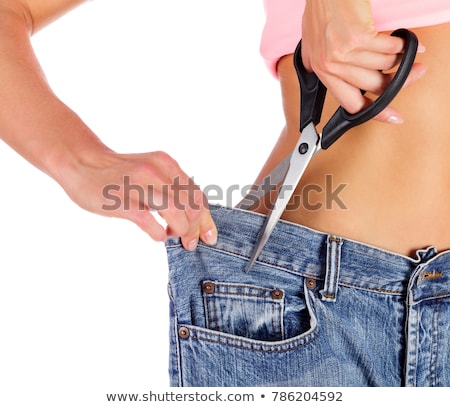 Stock photo: Weight Loss Concept - Closeup Shot Of Woman Showing Her Progress