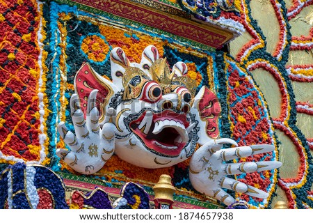 Stock photo: Bade Cremation Tower With Traditional Balinese Sculptures Of Demons And Flowers On Central Street In