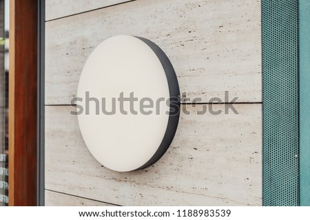 Stock fotó: Round Lightbox Sign Outside Shop Facade