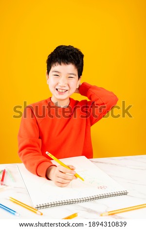 Stock photo: Boy Holding A Sketchbook