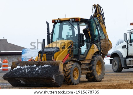 Stock fotó: Tractor Dismantles Asphalt