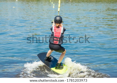 Stock photo: Young Girl Wakeboarder