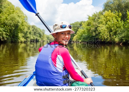 Stockfoto: Summer Vacation Portrait Of Happy Cute Girl Kayaking The On River