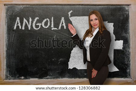 Teacher Showing Map Of Angola On Blackboard [[stock_photo]] © vepar5