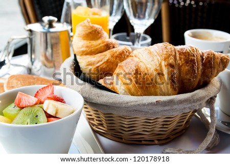 Breakfast With Coffee And Croissants In A Basket On Table [[stock_photo]] © ilolab