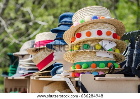 Foto d'archivio: Colorful Straw Hats Stacked In An Outdoor