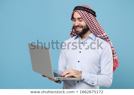 Foto stock: Arab Man With Laptop Isolated On White