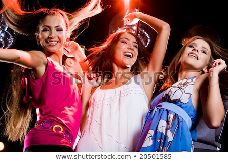 Stok fotoğraf: Three Smiling Women Dancing In The Club