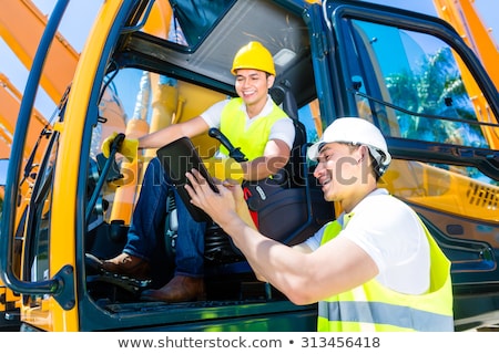 Foto stock: Asian Worker On Shovel Excavator Construction Site