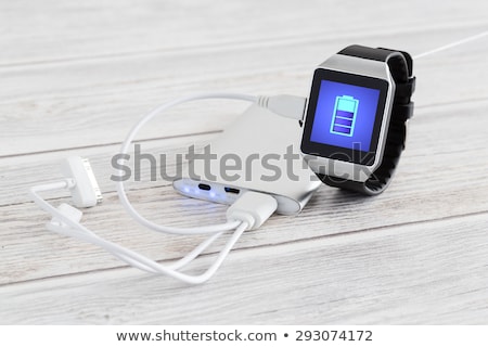 Foto d'archivio: Portable Powerbank Charger And Smart Watch