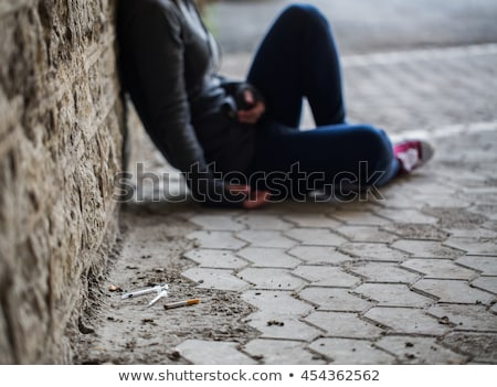 Сток-фото: Close Up Of Addicts And Drug Syringes On Ground