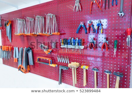 Foto stock: Various Tools Hanging At Wall In High School