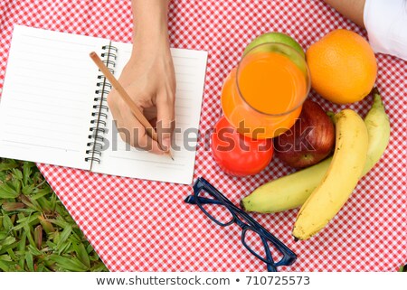 Stock photo: Woman Writing At Waterside In Nature