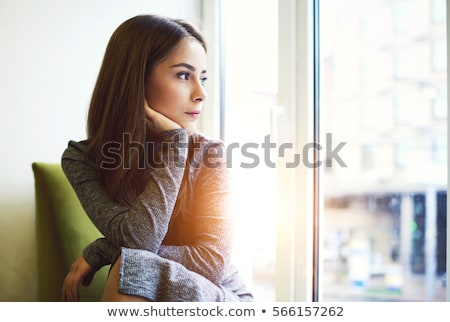 Stok fotoğraf: Portrait Of A Pensive Young Woman Looking Away