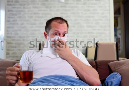 Foto stock: Portrait Of A Sick Man Wrapped In A Blanket
