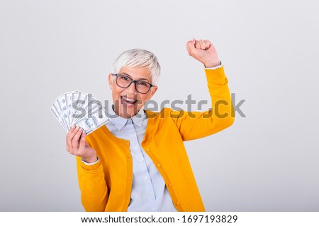 Senior Woman With Hundred Dollar Money Banknotes Zdjęcia stock © Photoroyalty