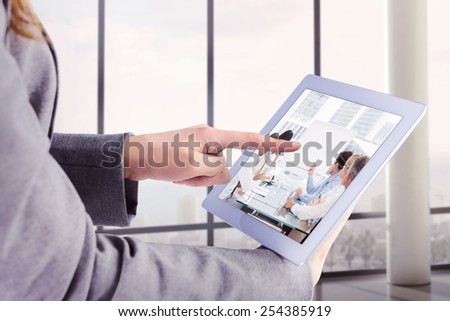 Foto d'archivio: Male Executive Using Digital Tablet In Conference Room