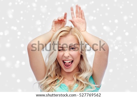 ストックフォト: Image Of Nice Cheerful Woman Winking And Making Fun With Earrings