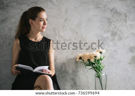 Stock photo: Beautiful Young Woman With Books And Flower