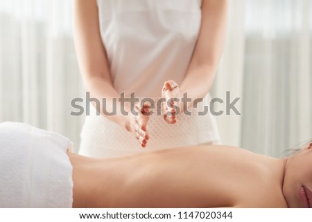 Сток-фото: Anonymous Massage Therapist Beating Back Of Woman