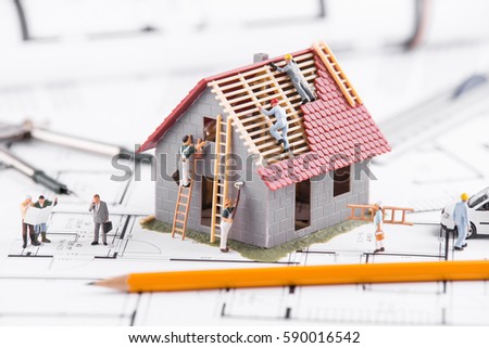 Stock photo: Architects Working With Blueprints On A New House Project