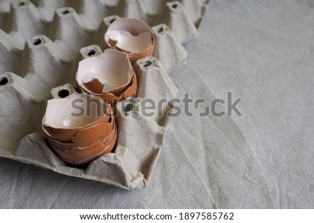 Stock photo: Carton Of Fresh Eggs With Three On The Rustic Wood Table