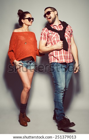 Smiling Fashion Couple Posing In Studio Stock photo © Augustino