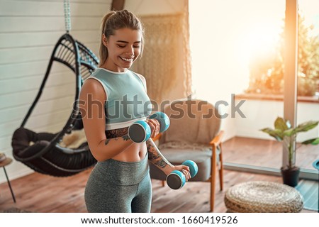 Stok fotoğraf: Young Woman Exercise With Dumbbells