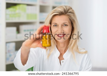 Stock fotó: Female Doctor Holding A Pill In Her Hand