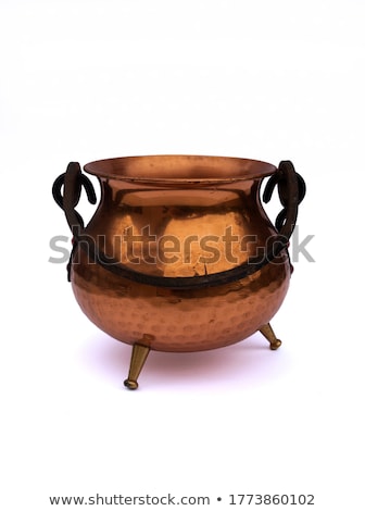 Foto stock: Witch Cooking In A Copper Cauldron