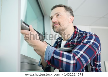 Stockfoto: Person Applying Silicone Sealant