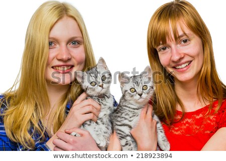 Foto stock: Two Girls Showing Young Silver Tabby Cats