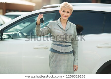 Stock fotó: Attractive Senior Woman In A Car
