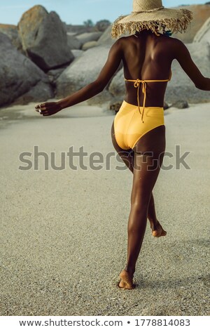 Stockfoto: Cropped Image Of A Girl In Summer Hat And Swimsuit