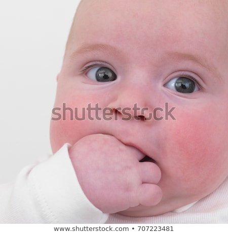 Stok fotoğraf: Baby Shoving Hand Into Mouth Close Up