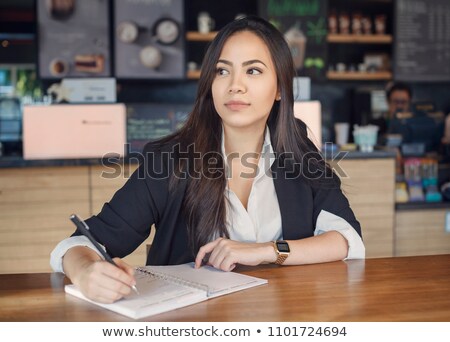 Zdjęcia stock: Attractive Women In Casual Business Sitting At A Table Working O