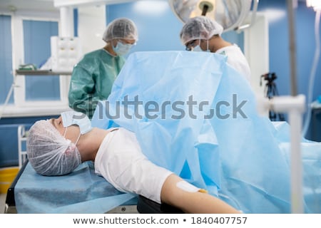 Stock photo: Young Man Lies On The Operating Table