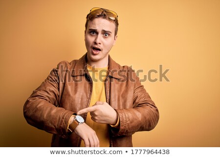 Foto stock: Young Fashion Man In Leather Jacket Looking Upset