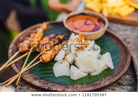 Stock photo: Indonesian Chicken Satay Or Sate Ayam Served With Lontong Soy Sauce And Peanut Sauce Lifestyle Food