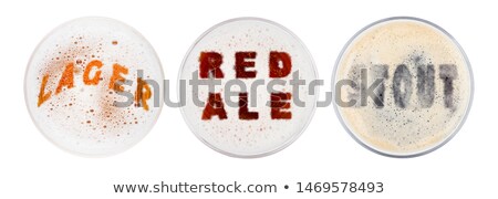Foto stock: Glasses Of Red Ale Stout And Lager Beer Letters