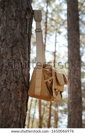 Shoulder Bag Hanging On Pine Tree Stockfoto © Lizard