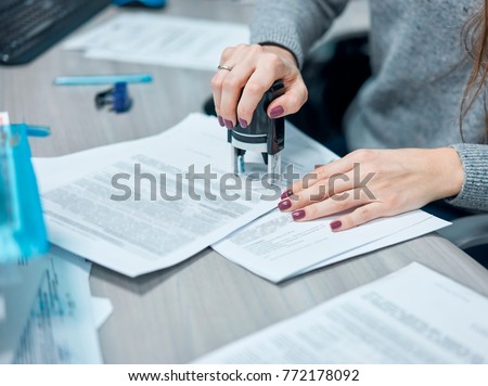 ストックフォト: Businesswoman Putting Stamp On Documents